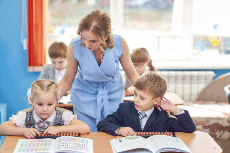 students from gem abacus program bein guided by teacher